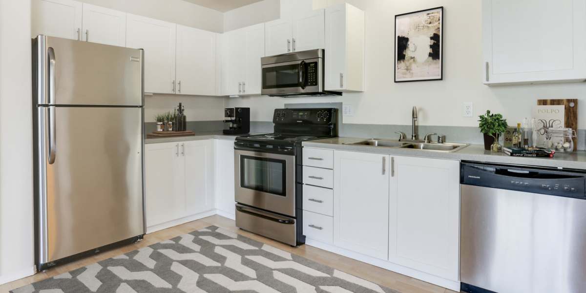 Kitchen with appliances at The Addison Apartments in Vancouver, Washington