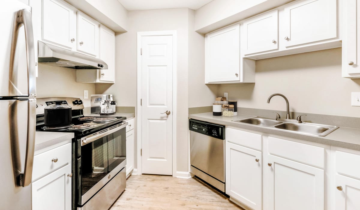 Kitchen with stainless-steel appliances at Bentley Green Apartment Homes, Jacksonville, Florida