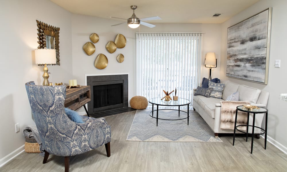 A furnished living room with a sliding door to the patio at Nine Two Six West in Augusta, Georgia