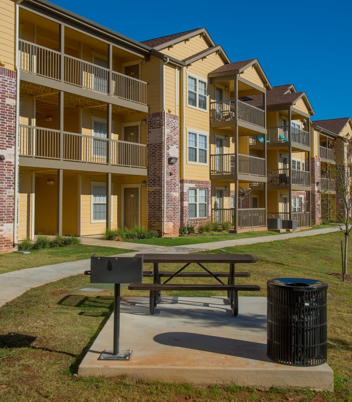 Picnic bench and grill at Mission Point Apartments in Moore, Oklahoma