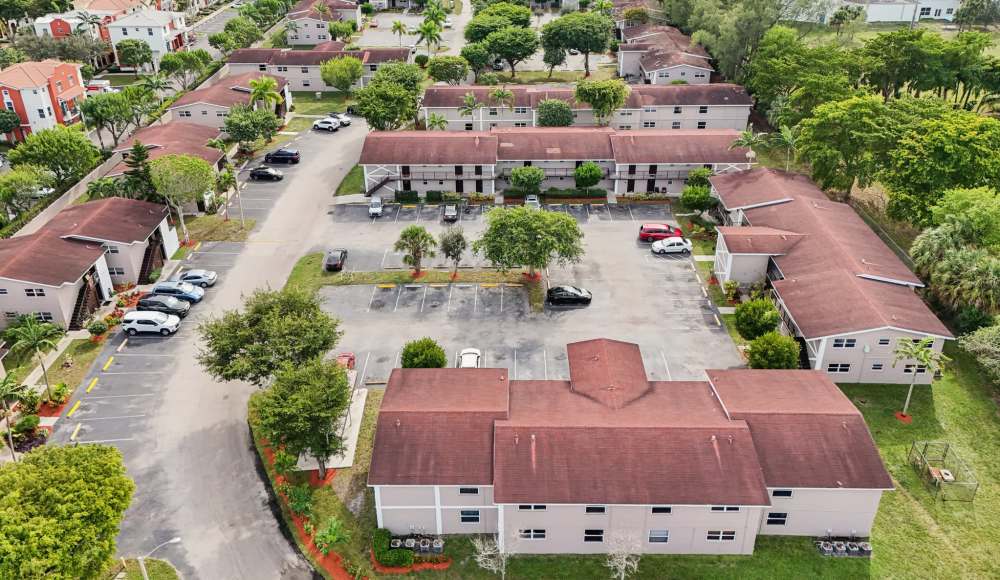Exterior drone shot of apartments at El Jardin Apartments in Hollywood, Florida