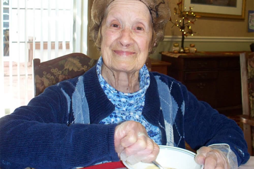 Resident of Heritage Hill Senior Community making food in Weatherly, Pennsylvania