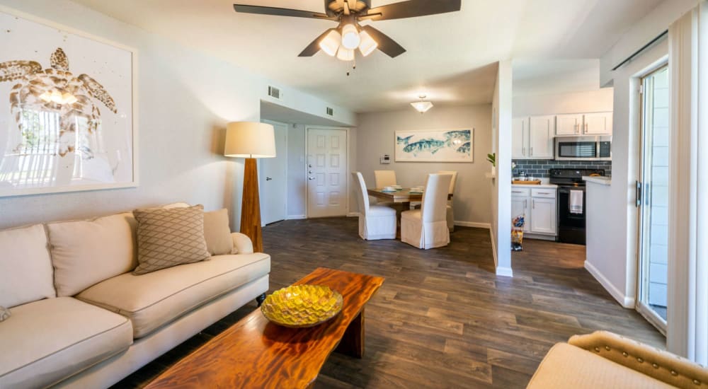 Resident living space with wood-style flooring at Waterside Apartments in Houston, Texas