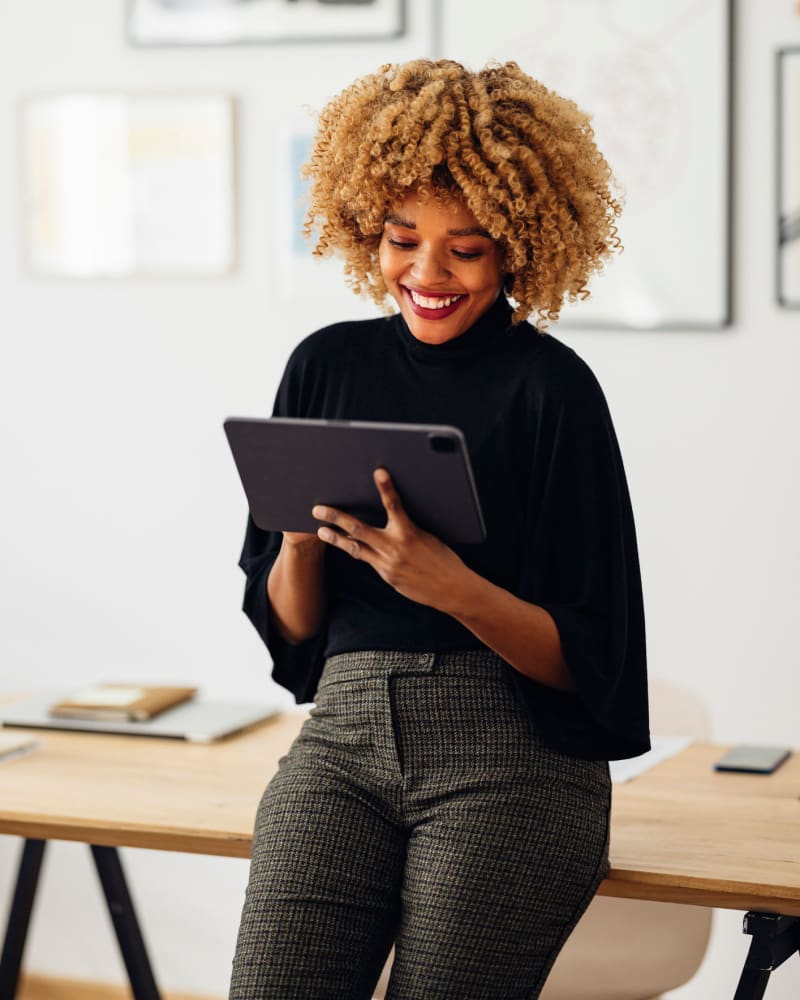 woman looking at tablet Horizon Realty in Jacksonville, Florida