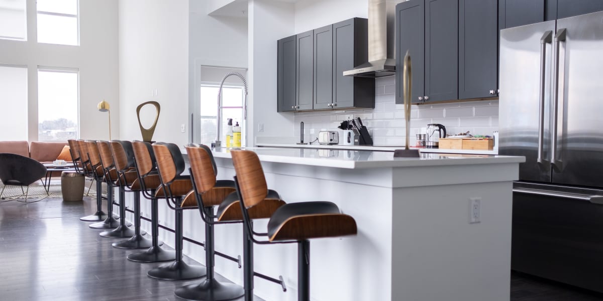 Community kitchen with bar seating at Marq Music Row in Nashville, Tennessee
