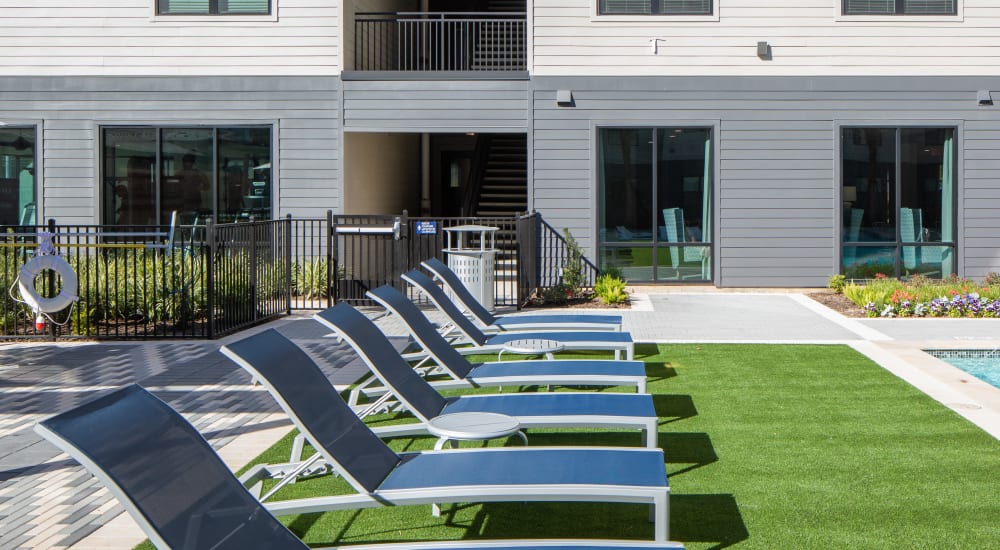 Lounge chairs by the pool at Bellrock Memorial in Houston, Texas