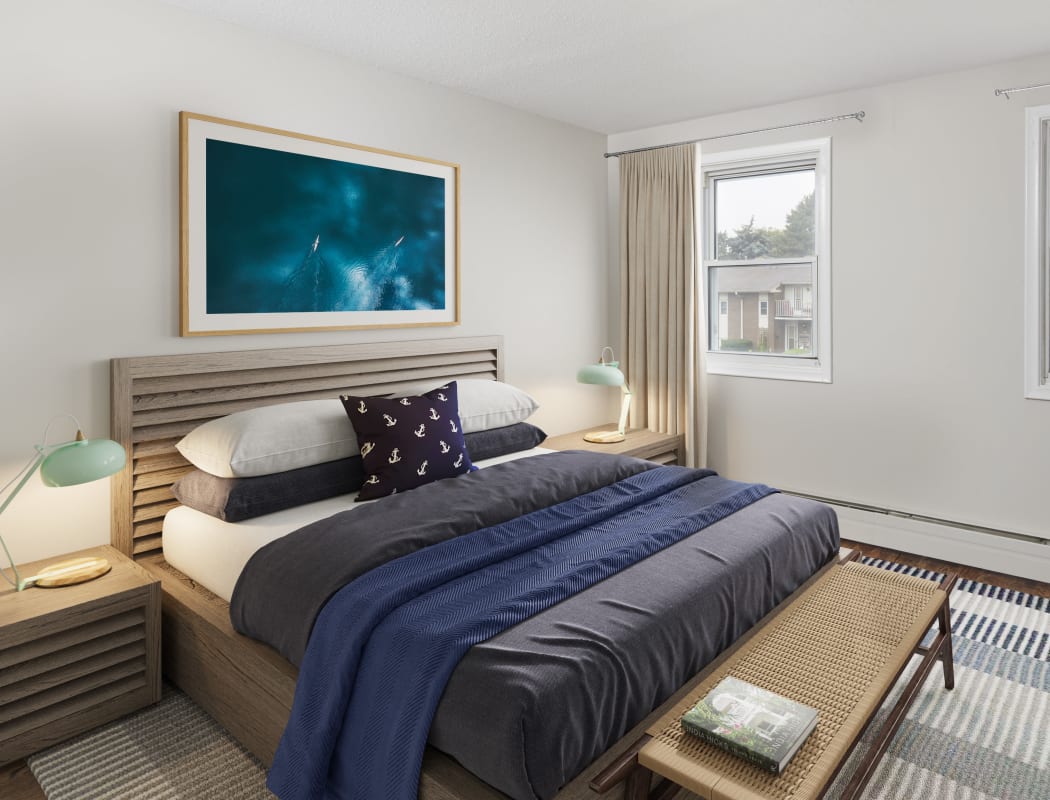 Model bedroom with tasteful decor at Georgian Court Estates in Burlington, Ontario