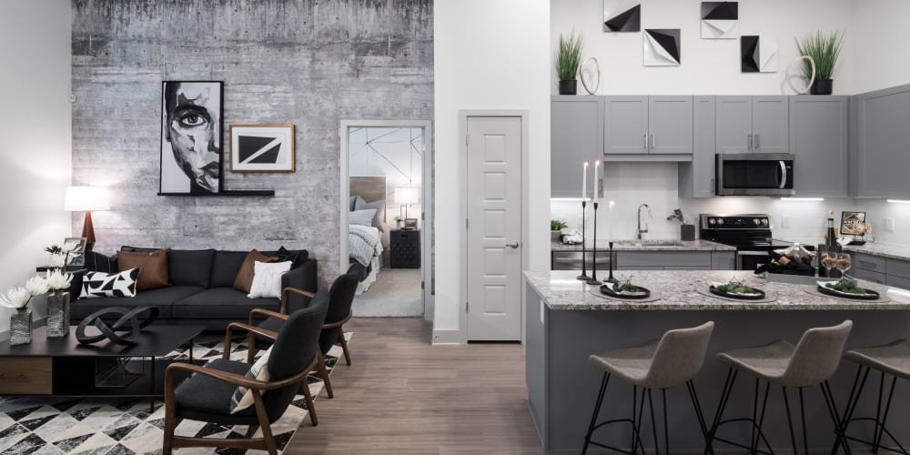 Open concept kitchen and living room at The ReVe in Garland, Texas