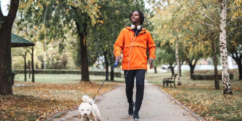 Resident walking their dog near Fox Run Apartments in Edgewood, Maryland