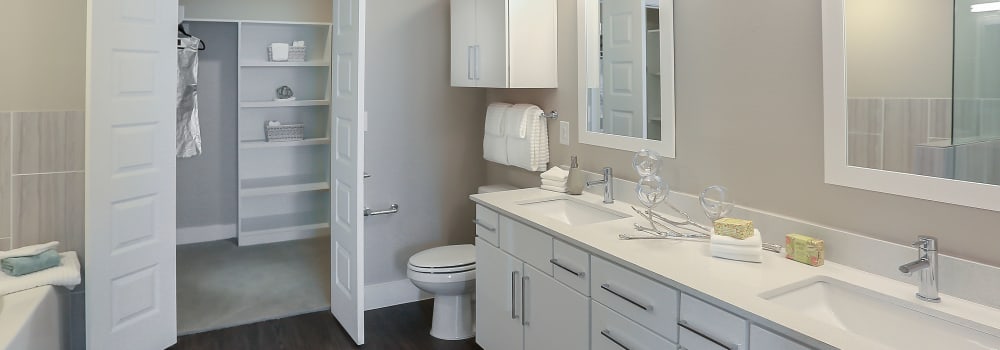 A large bathroom with a walk-in closet at Greenhouse in Houston, Texas