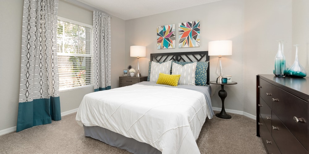 Spacious bedroom with large windows and lots of natural lighting during the day at The Avenue in Ocoee, Florida