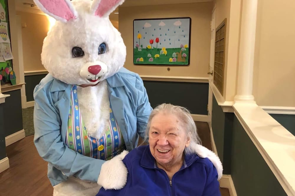 A resident with the Easter bunny at Lavender Hills Front Royal Campus in Front Royal, Virginia