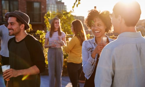 A group of friends gathered outside at Sycamore Commons Apartments in Fremont, California