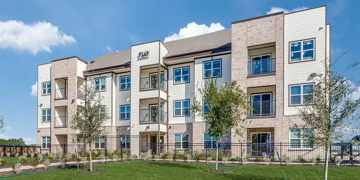 A happy resident family in their apartment home at The Trail Lakes in Fort Worth, Texas