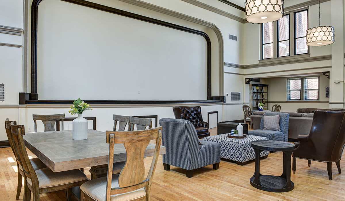 Clubhouse lounge with seating and dining area at Everts Hill Senior Living Apartments in Circleville, Ohio