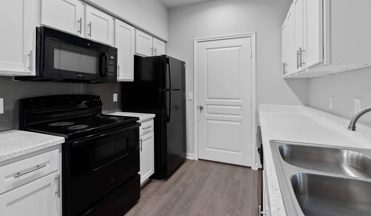 Black and white themed kitchen at Stoneleigh Corpus Christi in Corpus Christi, Texas