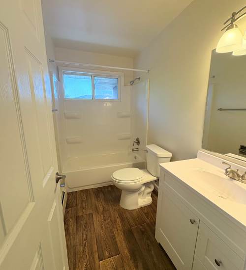 Apartment bathroom with bathtub and commode at Edgewood Group Apartments in Merrillville, Indiana