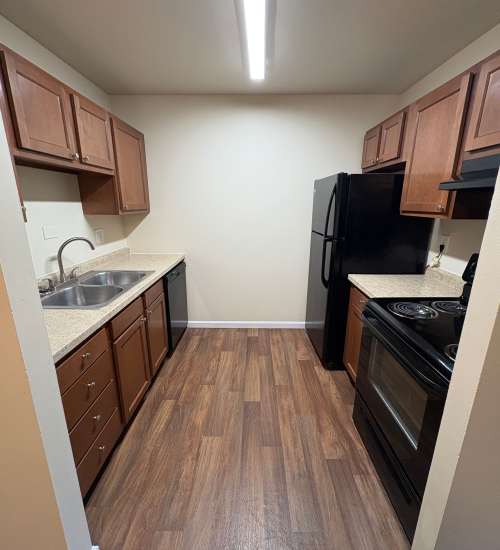 Kitchen in the apartment with steel appliances at Edgewood Group Apartments in Merrillville, Indiana