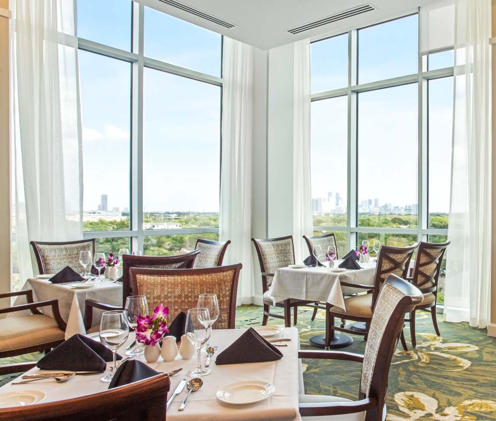 Resident enjoying a meal at The Village of Southampton in Houston, Texas