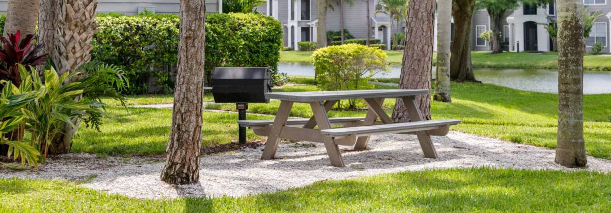 A mailbox and seating bench at Woodmere Apartments of Venice in Venice, Florida
