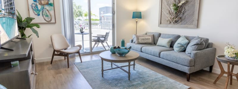 Model living room with lots of natural light at 275 Fontaine Parc in Miami, Florida