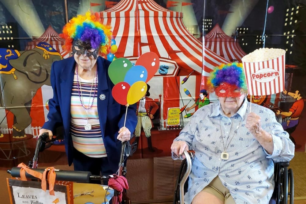 Two residents dressed up for a carnival themed party at Villas of Holly Brook Newton in Newton, Illinois