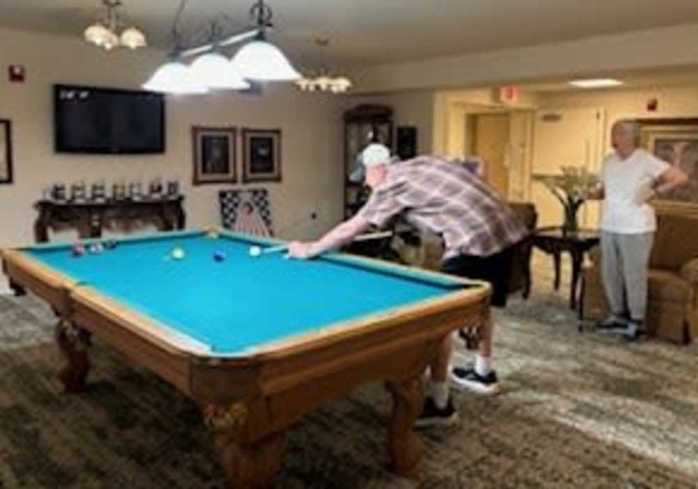 Residents playing billiards at Truewood by Merrill, Roseville in Roseville, California
