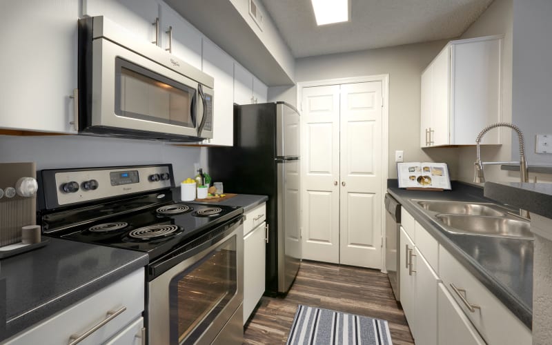 Renovated kitchen with stainless steel appliances at Altitude Westminster in Westminster, Colorado