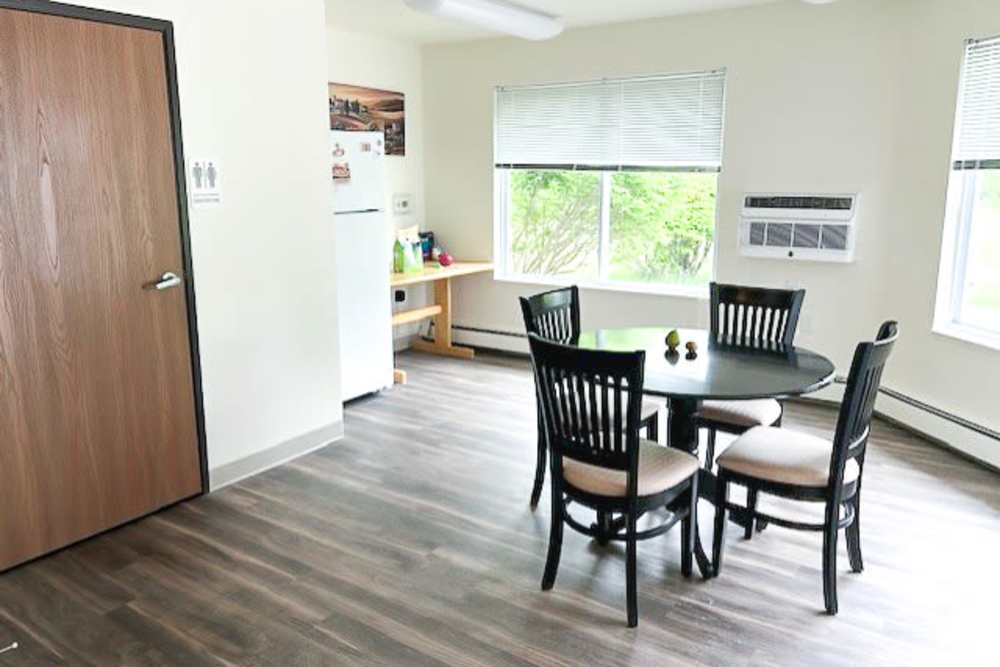 Apartment common area kitchen at Whispering Pines in Grayling, Michigan