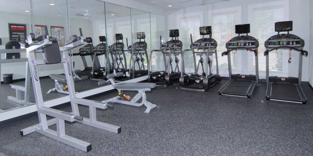 Fitness studio with treadmills and television at Haven at Wild Dunes in Newport, North Carolina