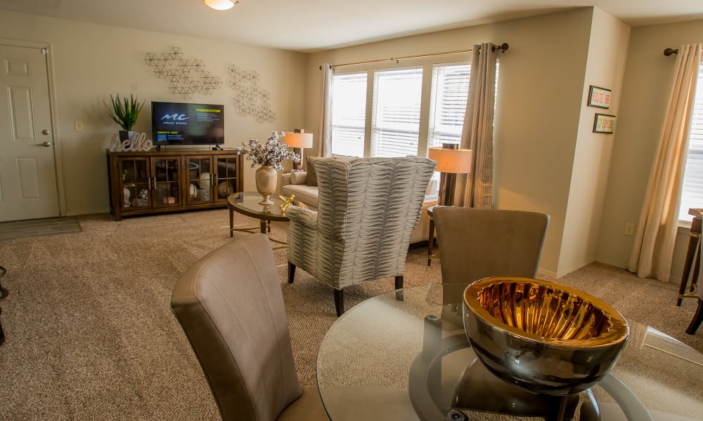 Dining area and living room at Icon at Broken Arrow in Broken Arrow, Oklahoma