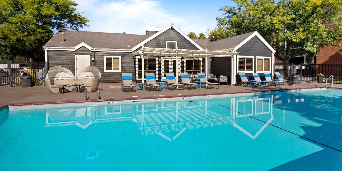 Poolside Loungers and Resort Pool at Royal Ridge Apartments in Midvale, Utah