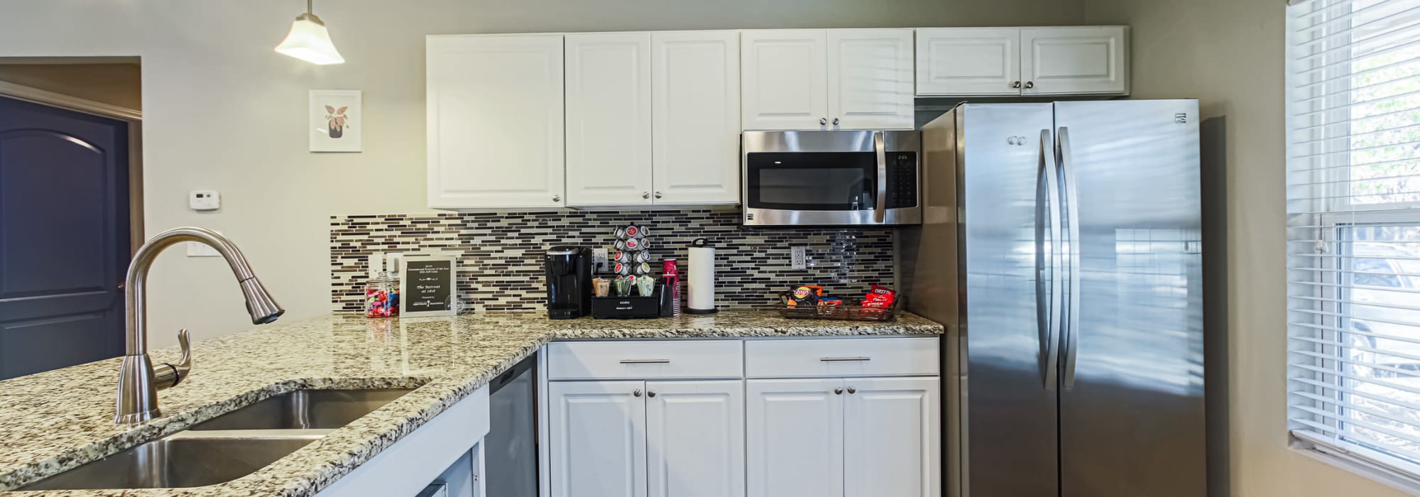 The clubhouse kitchen area at Retreat at 2818 in Bryan, Texas