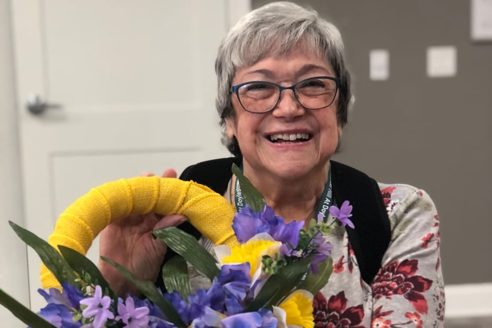Resident with flowers at Mercer Hill at Doylestown in Doylestown, Pennsylvania