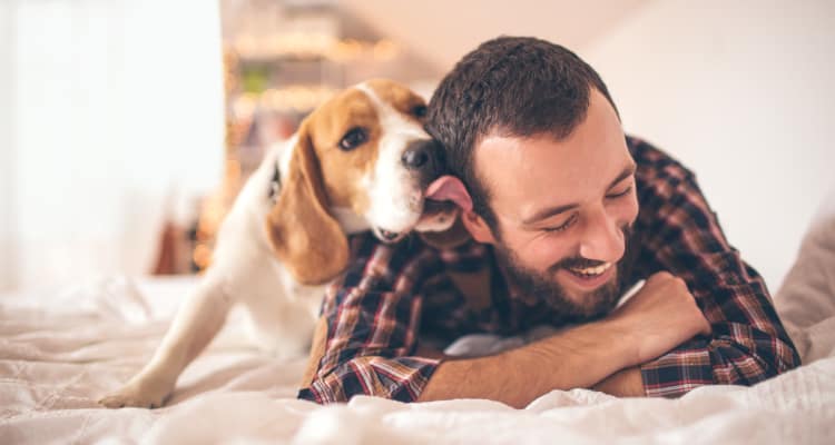 Resident playing with his dog at Walden Pond Apartments in Everett, WA