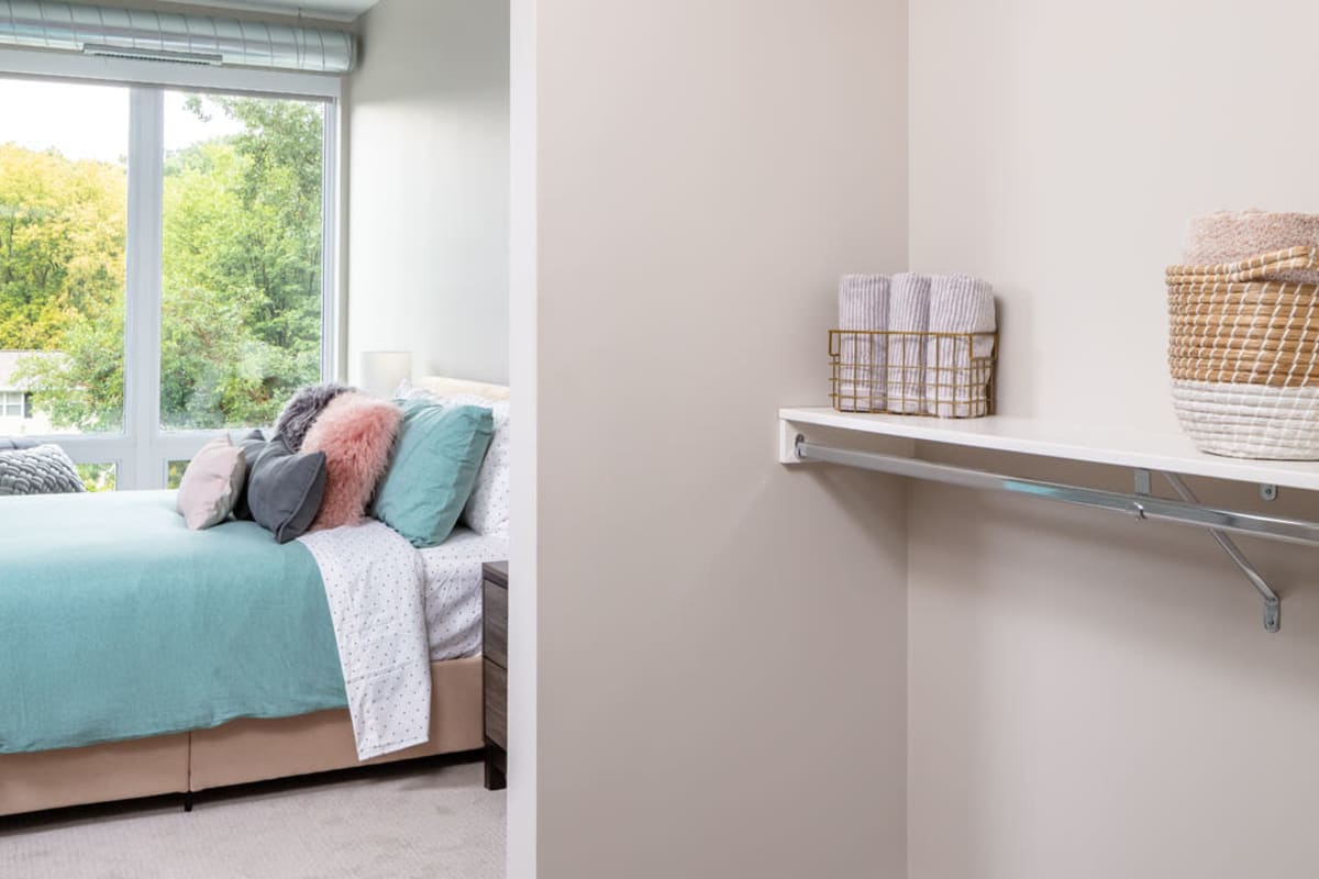 Apartment bedroom with a walk-in closet at Talo in Golden Valley, Minnesota