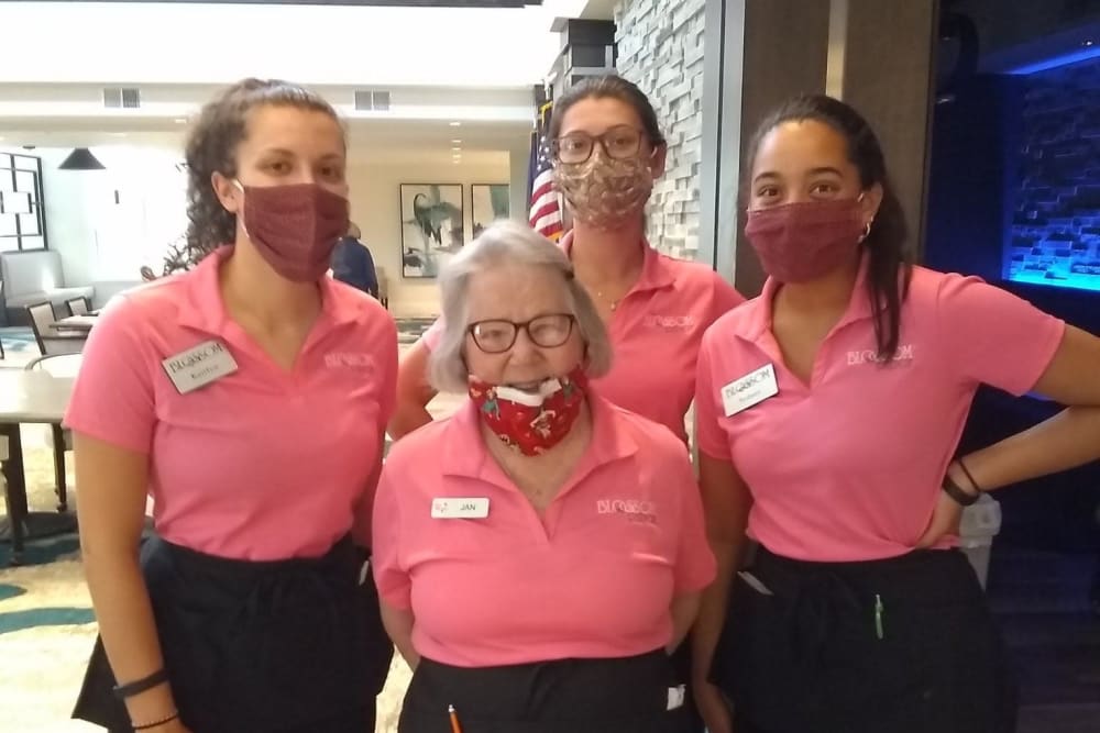 Employees and a resident posing for a photo at Blossom Ridge in Oakland Charter Township, Michigan