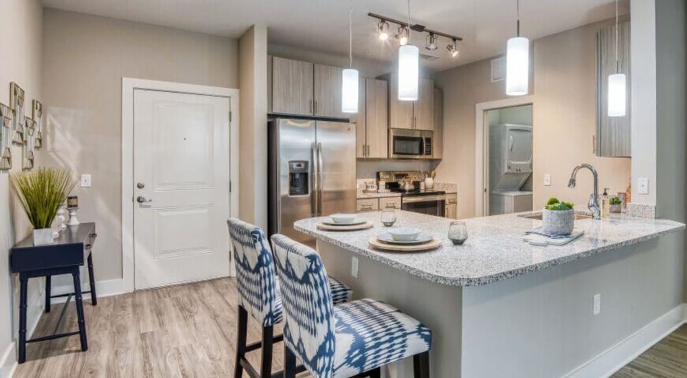 Bar seating in an apartment kitchen at The Lively Indigo Run in Ladson, South Carolina