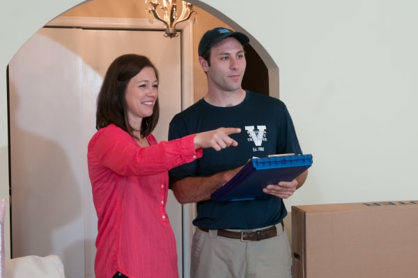 Virginia Varsity Transfer employee performs a walkthrough with a customer.