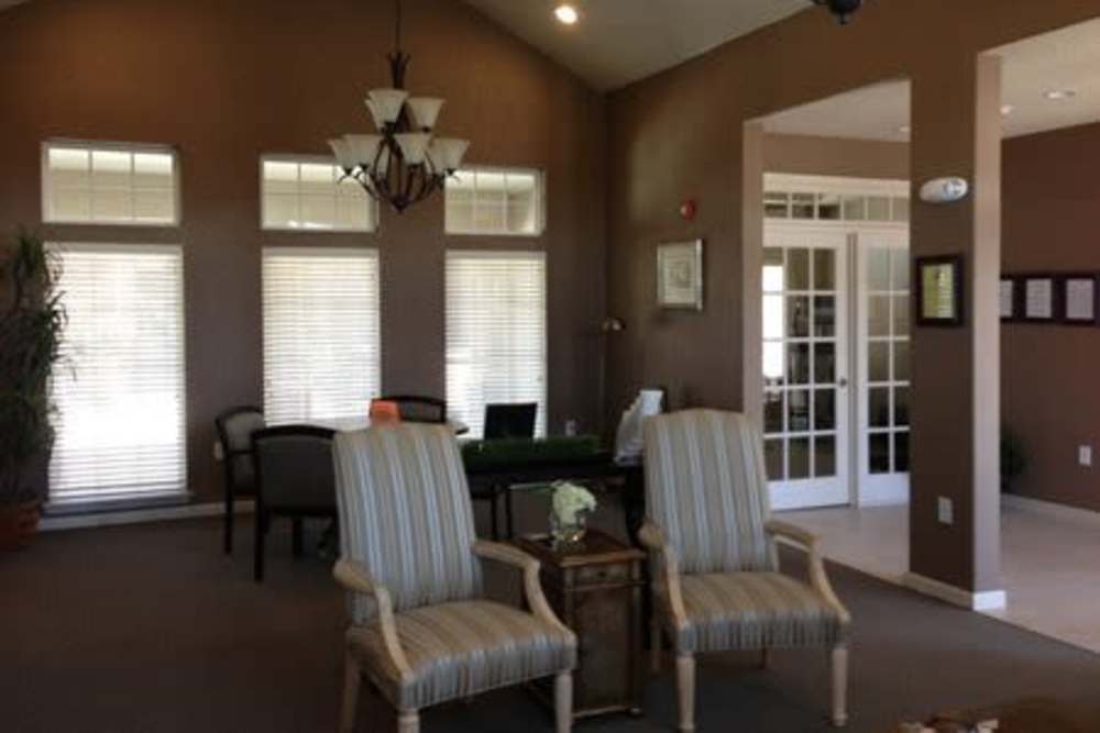 Clubhouse seating area with natural light at Gateway Plaza Apartments in Midland, Texas