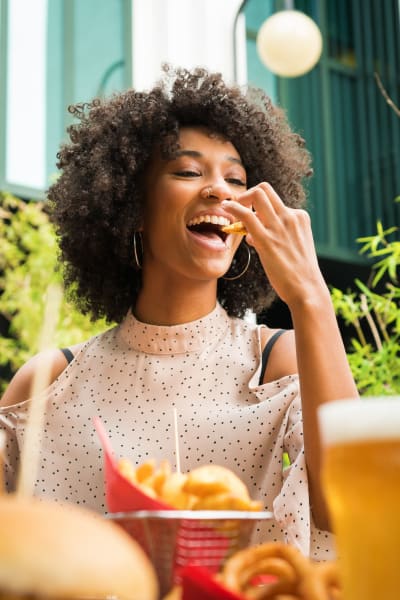 A resident enjoys a cocktail at her favorite spot near Los Robles Apartments, Thousand Oaks, California
