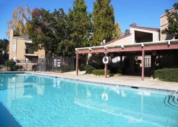 Swimming pool area at Waterfield Square Apartment Homes