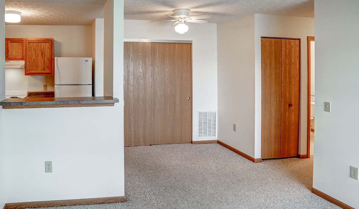 Bright living room with access to kitchen at Heritage Greene in Washington Court House, Ohio