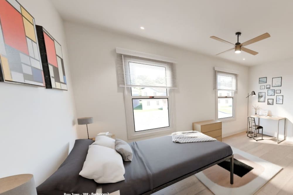 New bedroom with natural light and workspace at Russ Town Crossing in Ruston, Louisiana