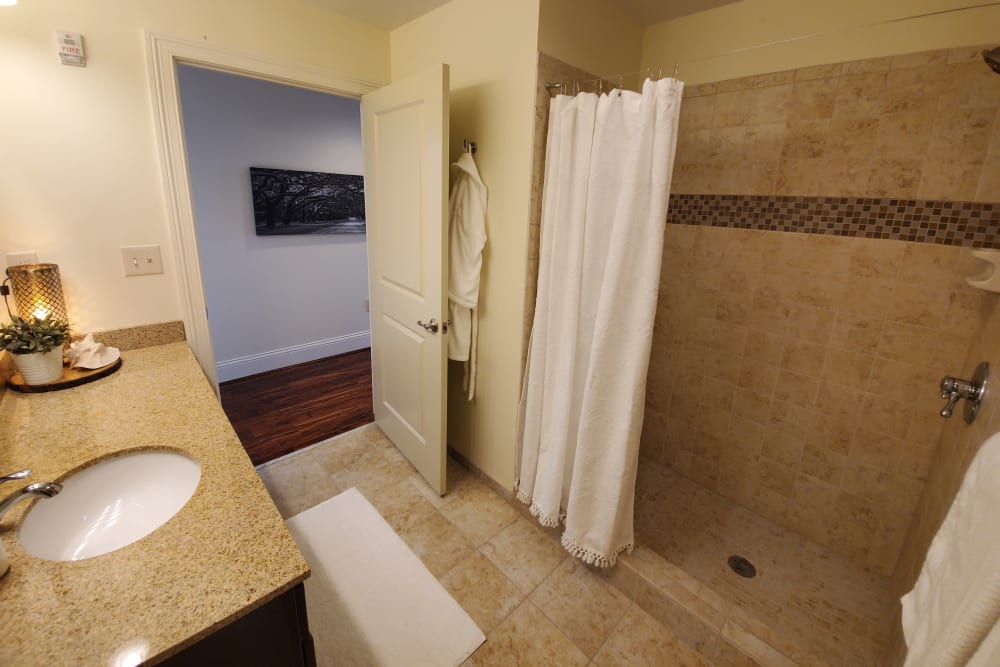 Bathroom with tiled shower at The Reserve at 4th and Race in Cincinnati, Ohio