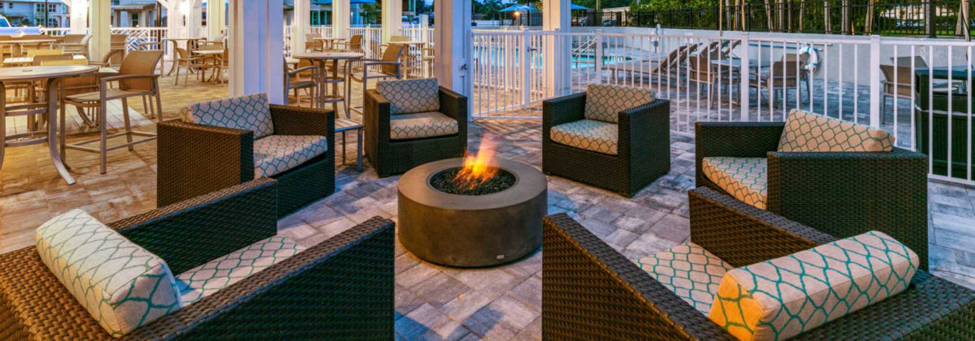Community seating area with firepit at The Bergamot Apartments On 780 in Sarasota, Florida