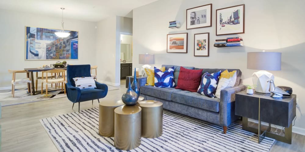 Apartment living room with wood-style flooring at Villas at Princeton Lakes in Atlanta, Georgia