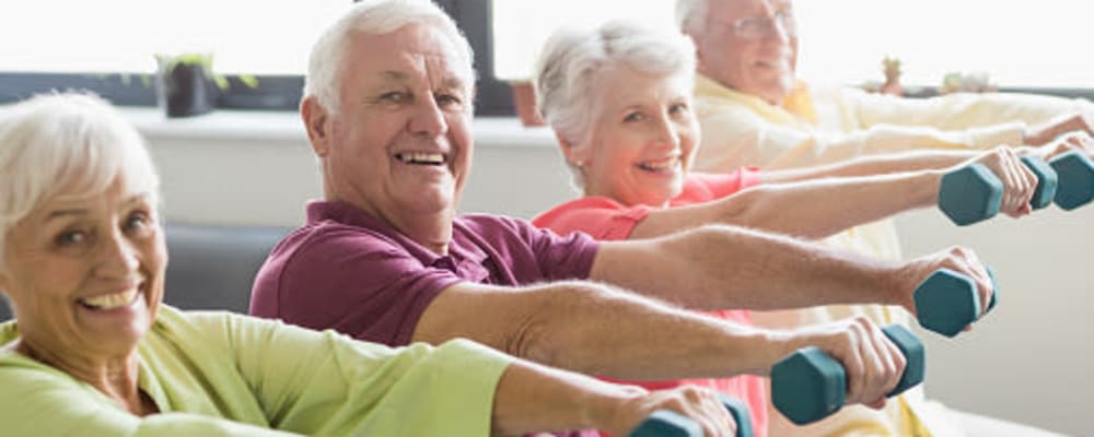 Residents engaged in a group exercise at The Springs at Lancaster Village in Salem, Oregon