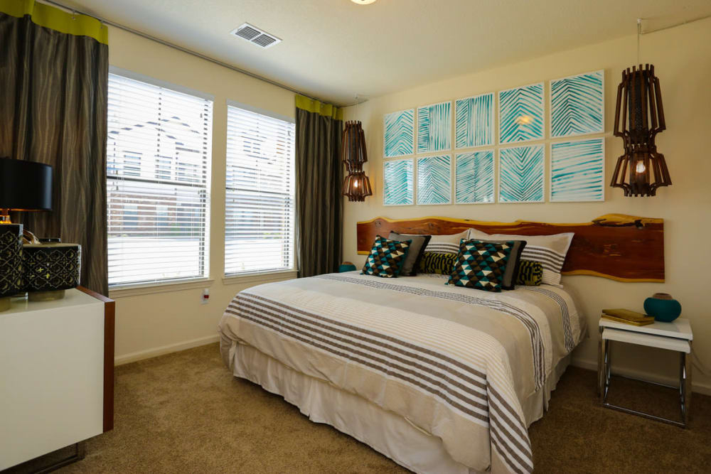 Large bay windows in a model home's bedroom at The Hawthorne in Jacksonville, Florida