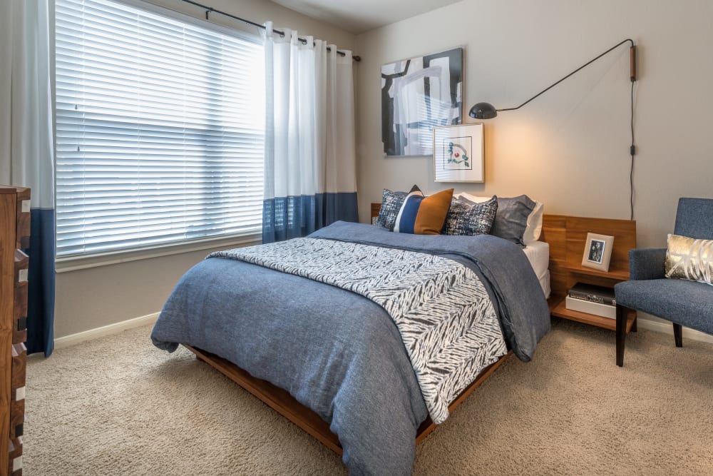 Model bedroom at 75 West in Dallas, Texas